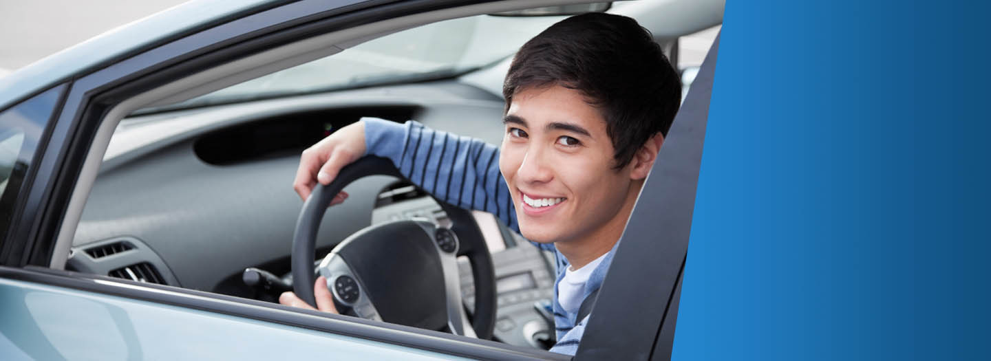 Young adult driving car
